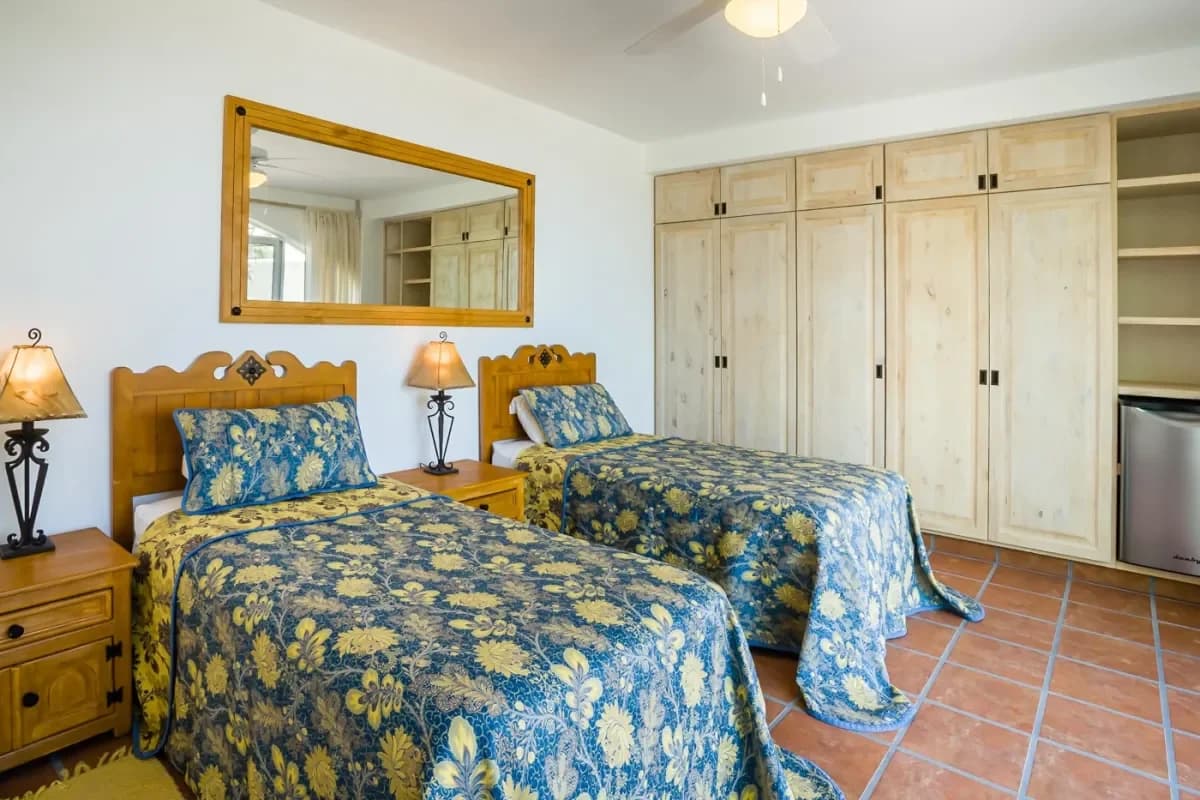 Bedroom 5 at Your Ultimate 2026 Cabo San Lucas Property Management Guide two twin beds, blue floral bedding