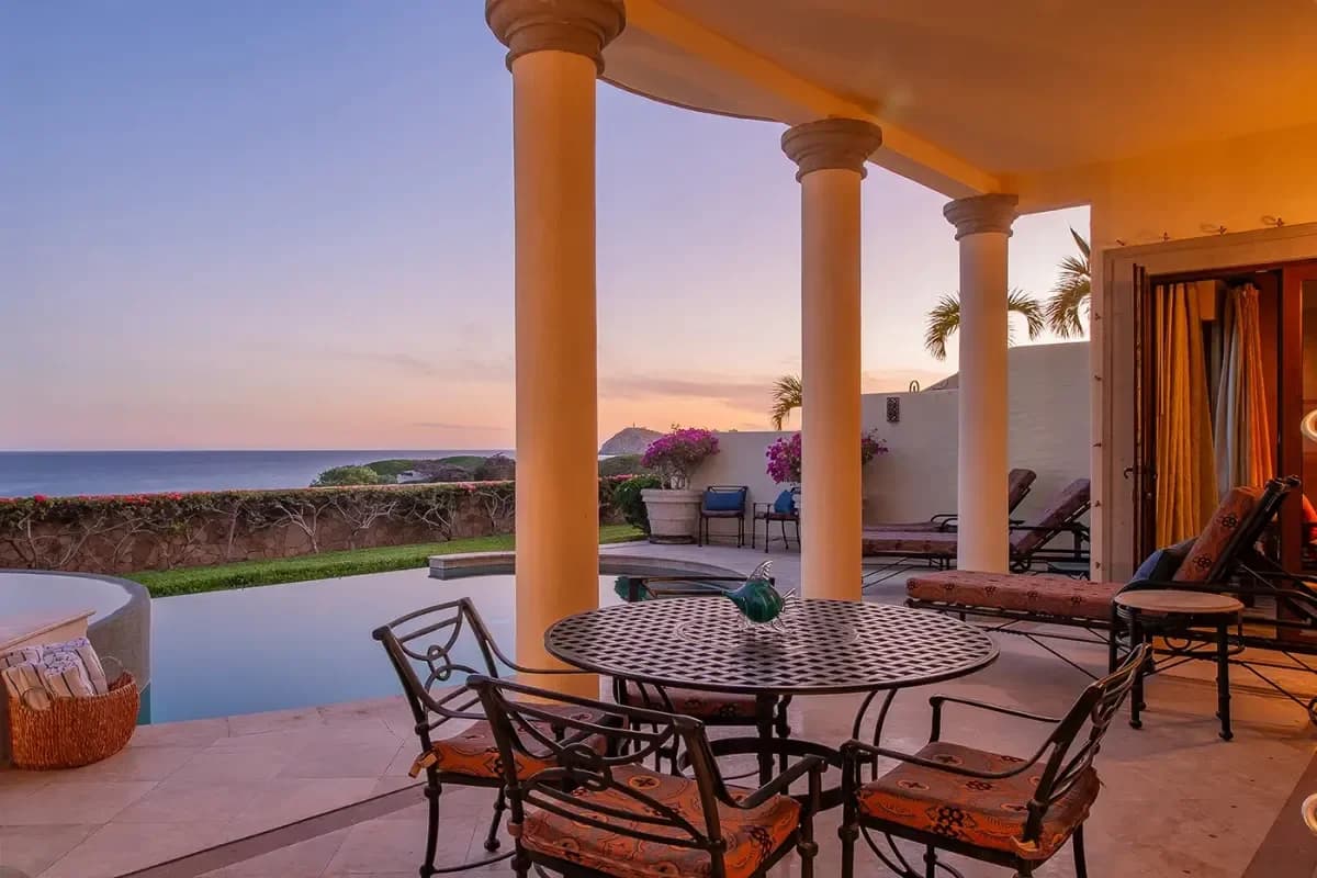 Outdoor dining area at Discover the Best Spa in Cabo San Lucas for Ultimate 2026 Wellness with columns at sunset