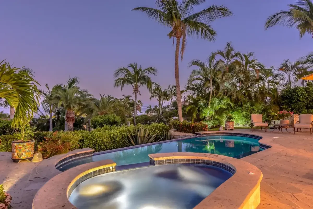 Infinity pool at Villa Las Brisas at dusk, with ocean view in Palmilla