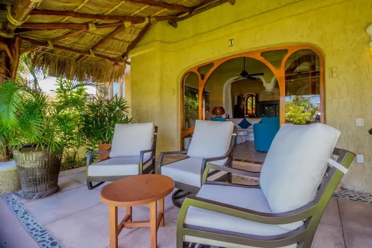 Outdoor patio 2 at Your Dream Honeymoon Villa in Cabo San Lucas: A Romantic 2026 Escape with lounge chairs, table