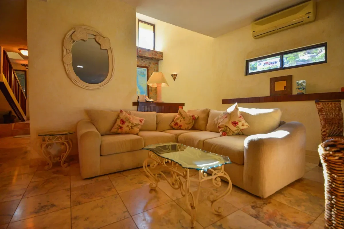 Living room at Medano Vs Chileno Beach with sectional sofa, lamp