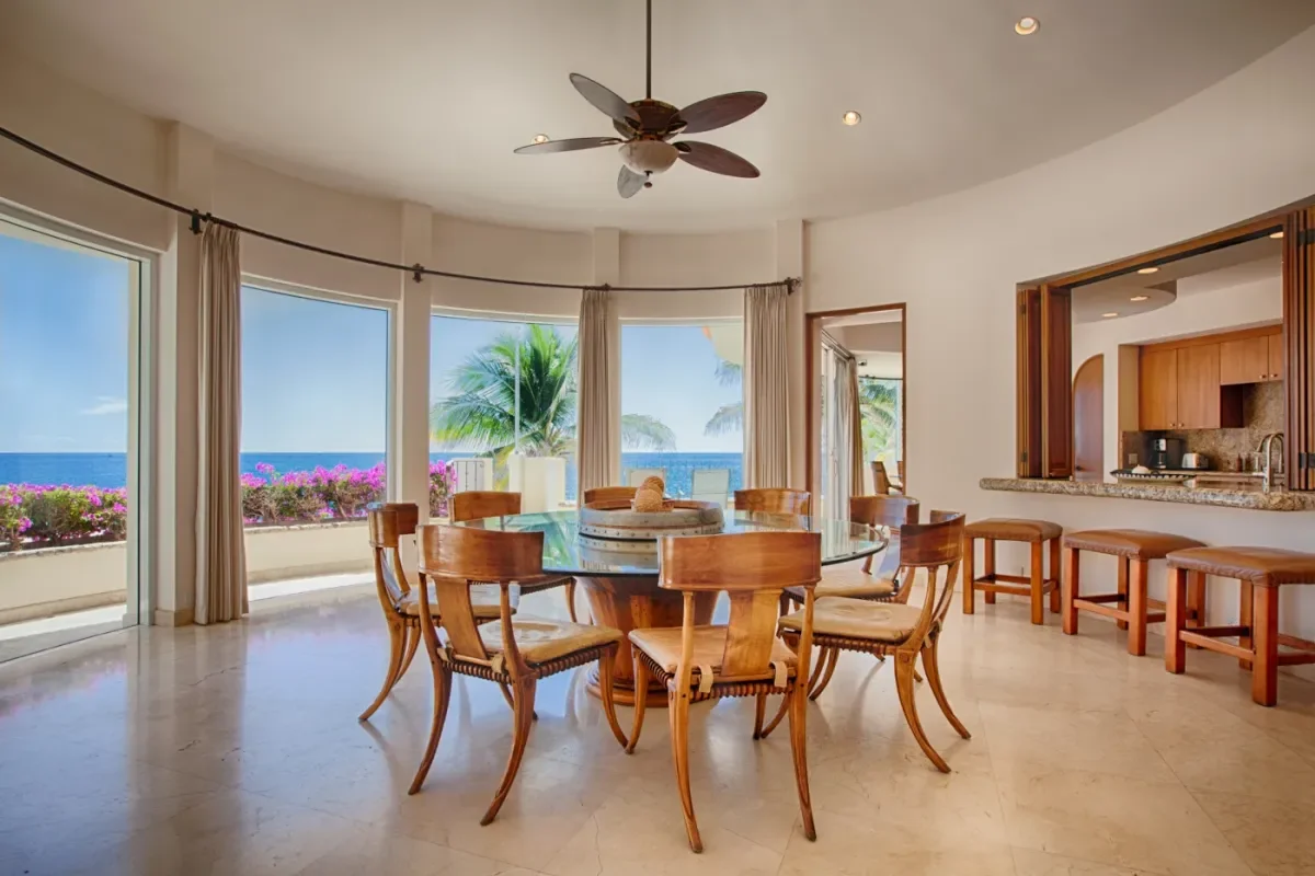 Dining room at Unlock Luxury: Insider Tips for Booking Villas in Cabo San Lucas 2026 with ocean view, palm trees