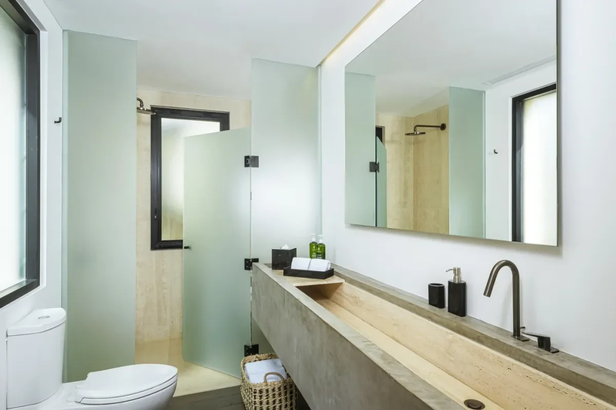 Bathroom vanity 1 at Your 2026 Guide to the Ultimate Cabo San Lucas Villa with Ocean View with frosted-glass partition