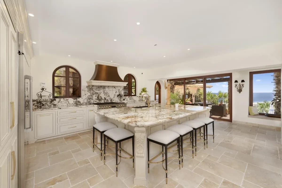 Kitchen island at Ultimate Hydrotherapy Cabo San Lucas Spa Guide for 2026 with bar stools, granite countertop