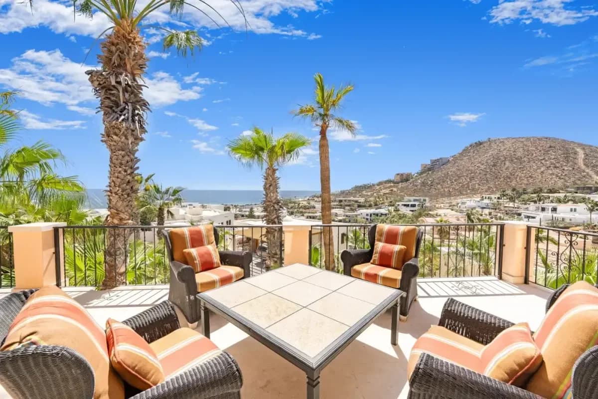 Outdoor balcony at Exquisite Cabo Wedding Catering: Menu Ideas for Your 2026 Celebration with palm trees, ocean view