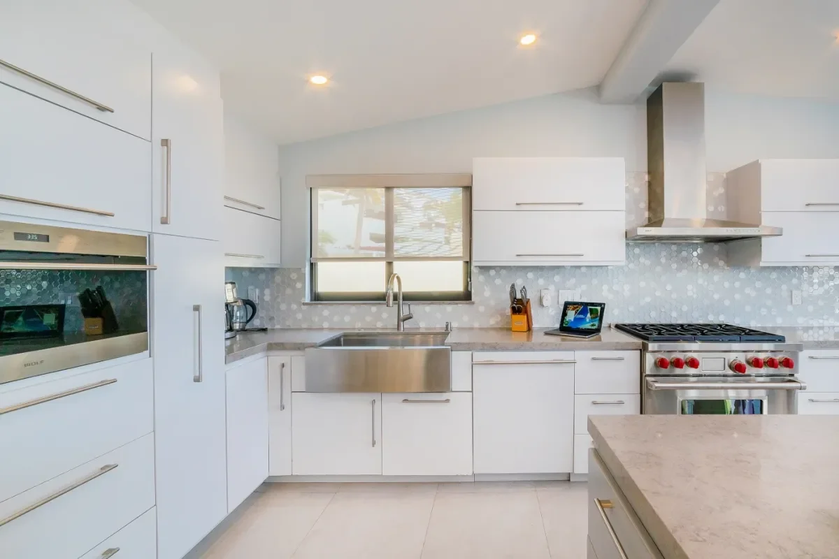 Kitchen sink at Medano Beach Parking with white cabinets