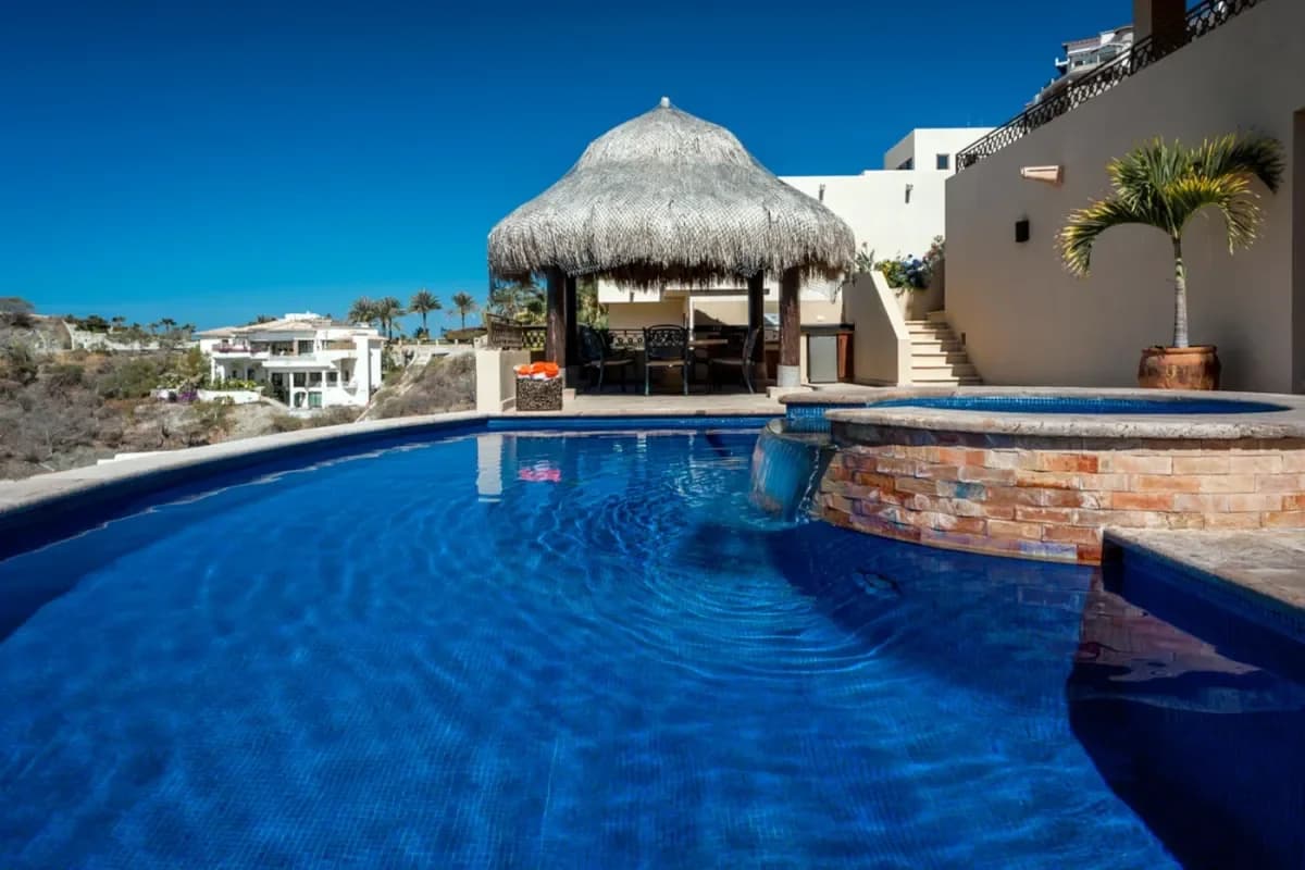 Pool area at Santa Maria Beach Parking with palapa and water feature