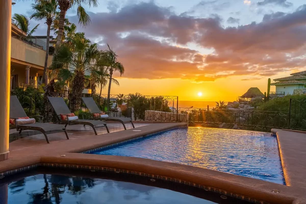 Infinity pool at Villa Sol Y Luna at sunset, with ocean beyond in Pedregal Pacific