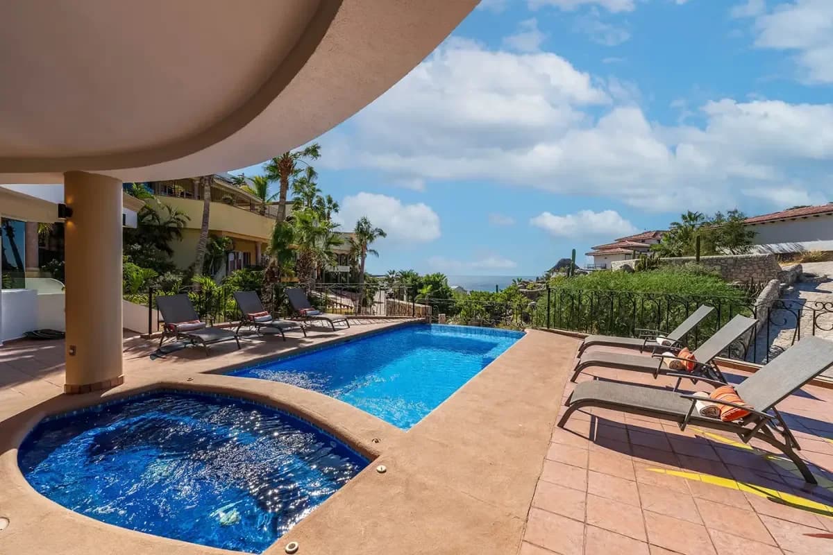Infinity pool at Couples Massage Cabo Reviews with ocean beyond, sunny day