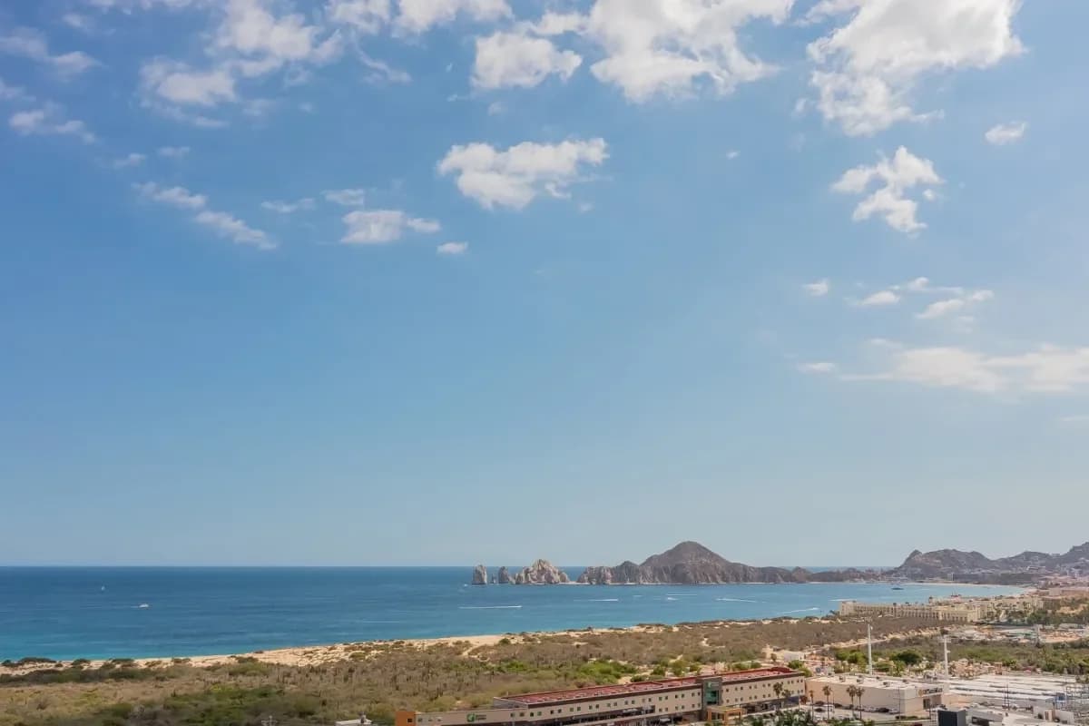 Ocean view at Pedregal Bay vs Palmilla: Which Cabo Villa Area Fits Your Trip with rock formations and coastline