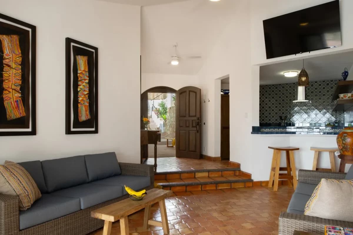 Entryway at Worst Time To Visit Cabo with open wooden door, tiled floor