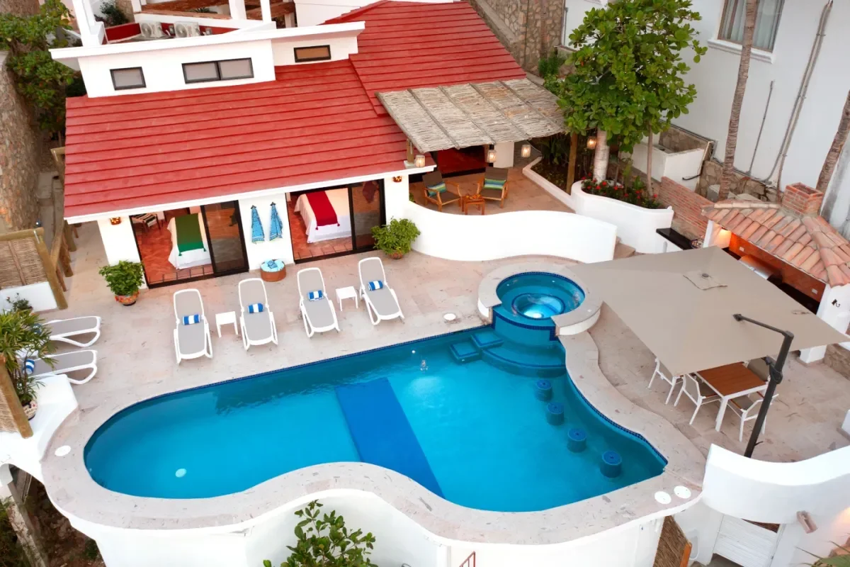 Pool area aerial at Vivir en Cabo con tu Perro with red roof, daytime