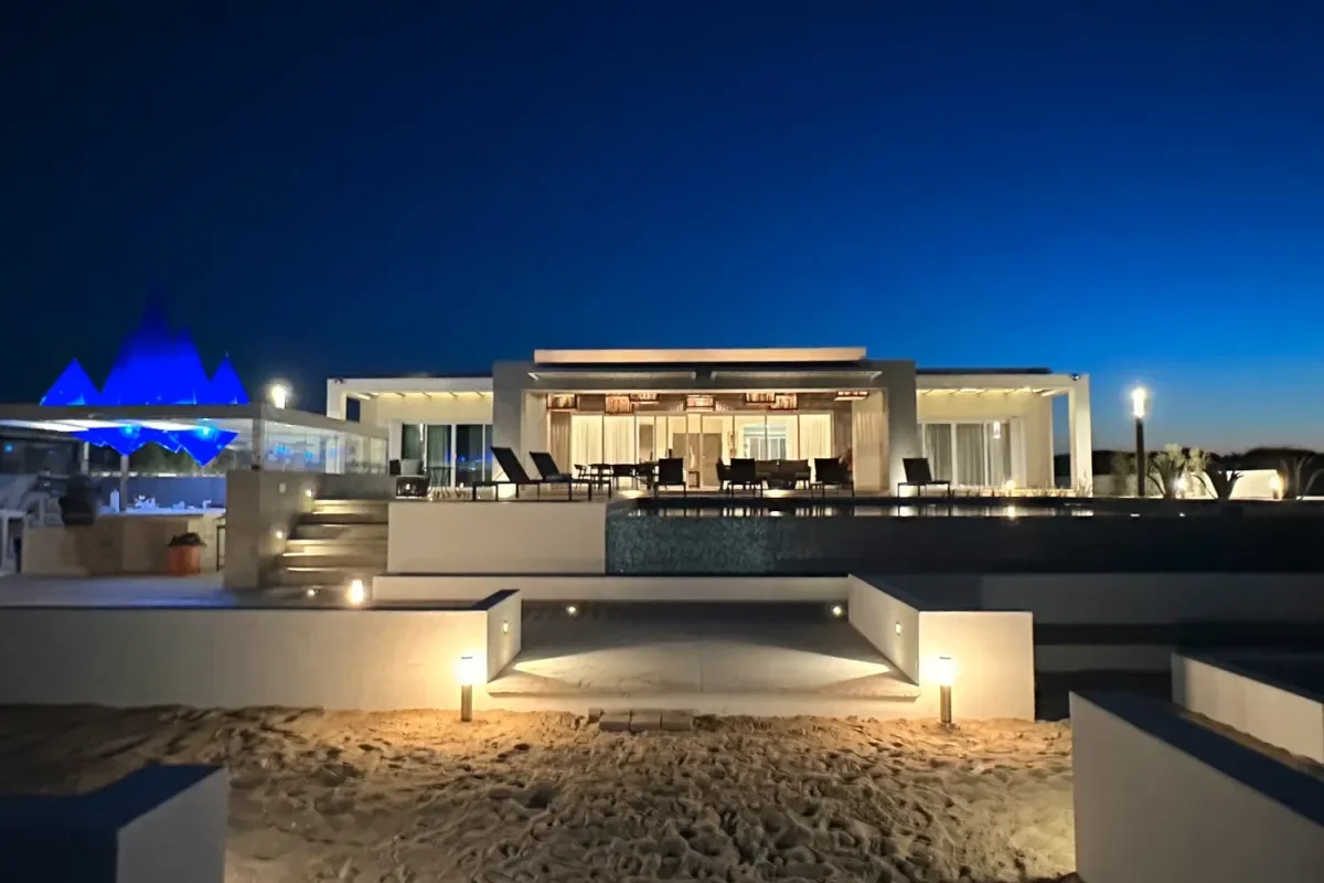 Infinity pool at Indulge in Exclusivity: Your Guide to Private Wine Tasting in Cabo San Lucas 2026 at night, with lounge