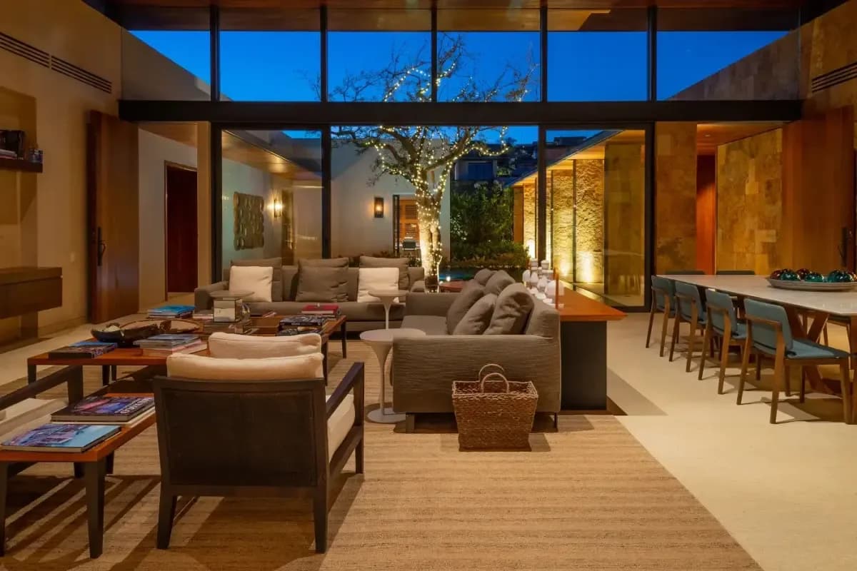 Living area 4 at VRBO Cabo Alternative: How Locals Actually Book Luxury Villas with lit tree outside, evening