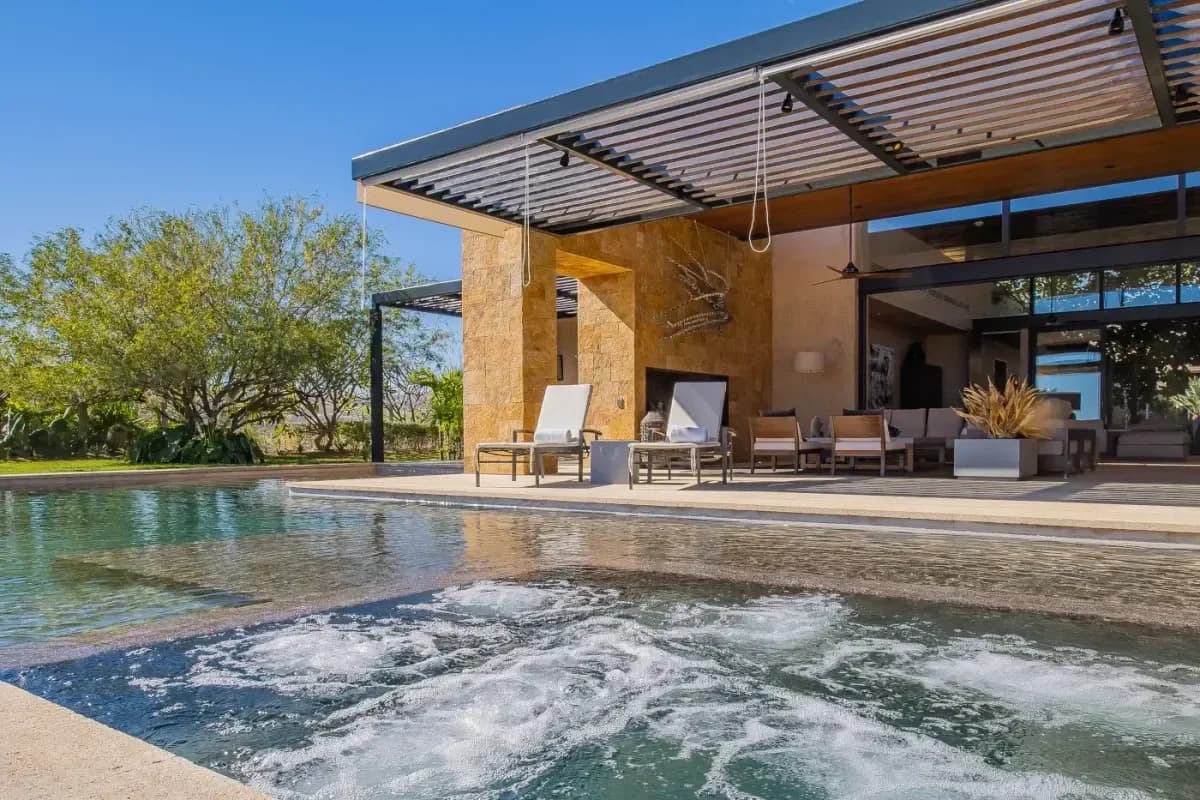 Hot tub at Your Ultimate Guide to a Christmas Villa Rental in Cabo San Lucas 2026 with lounge chairs and pergola