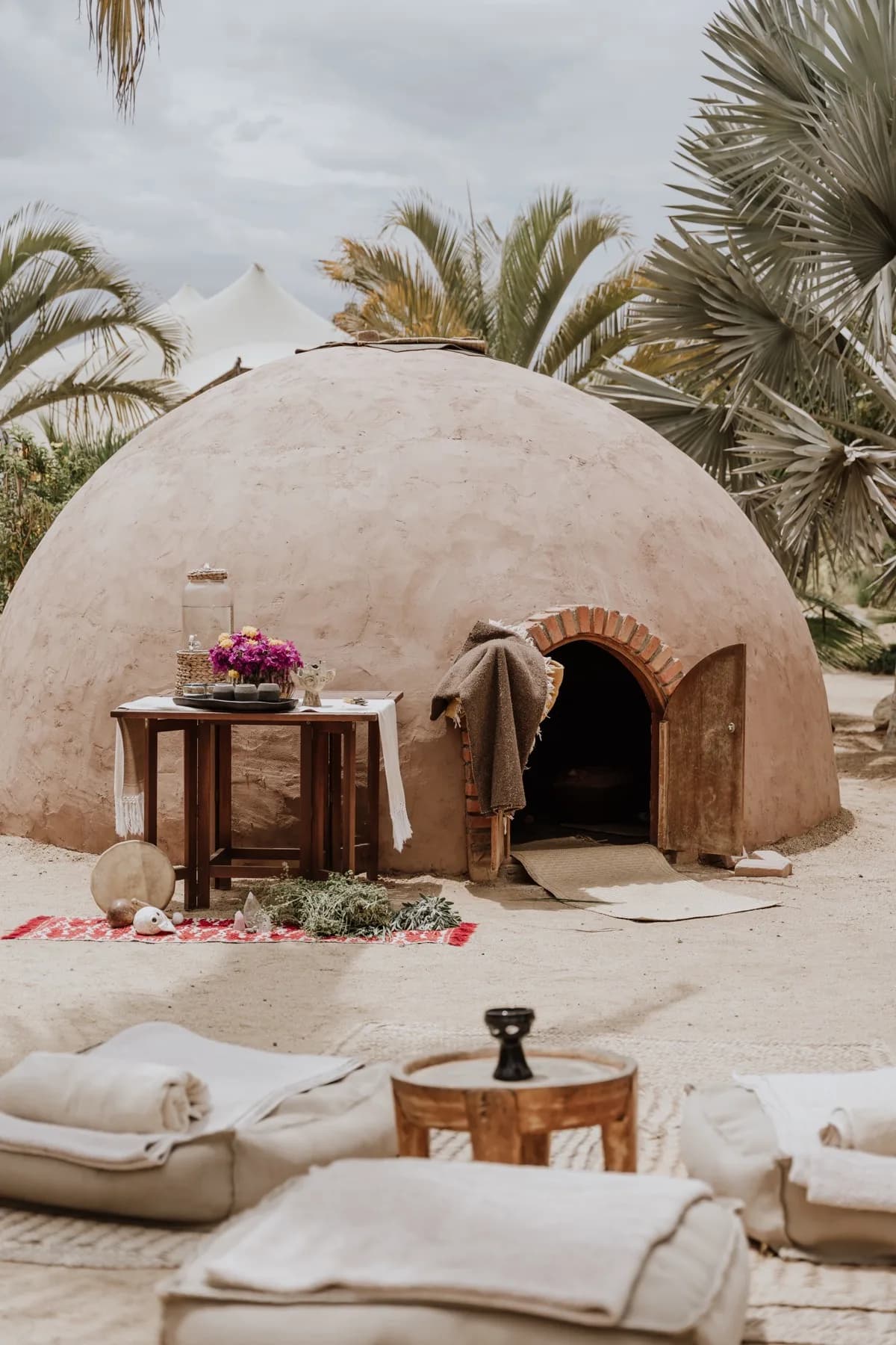Outdoor oven at Temazcal Ceremony adobe-style, with-palm-trees in Los Cabos