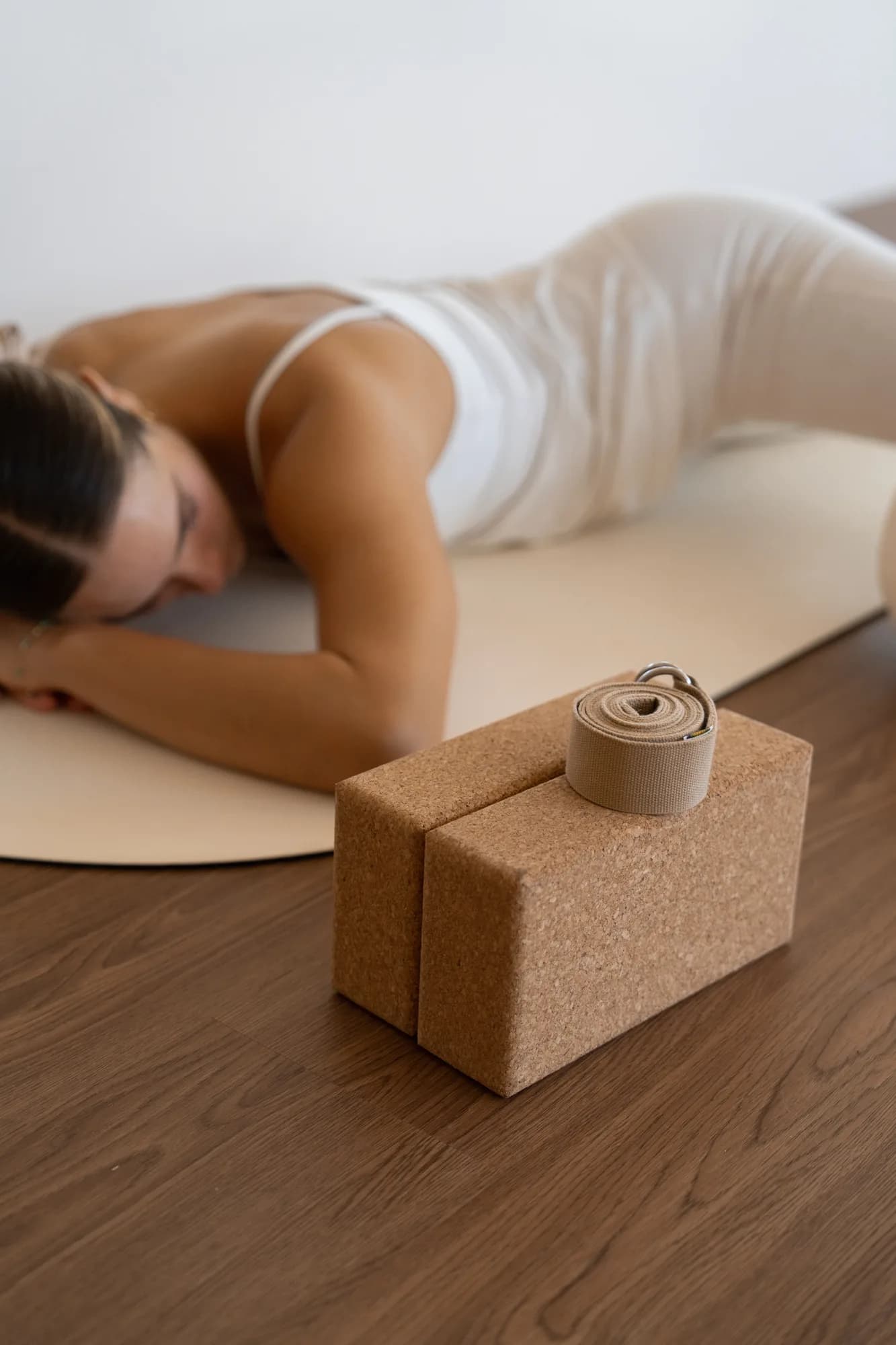 Yoga blocks at Somatic Yoga on-wooden-floor, blurred-person in Los Cabos