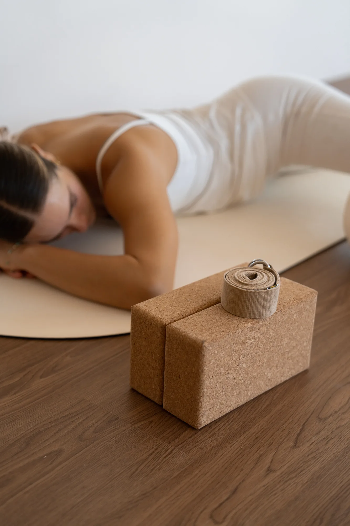 Yoga blocks at Somatic Yoga on-wooden-floor, blurred-person in Los Cabos