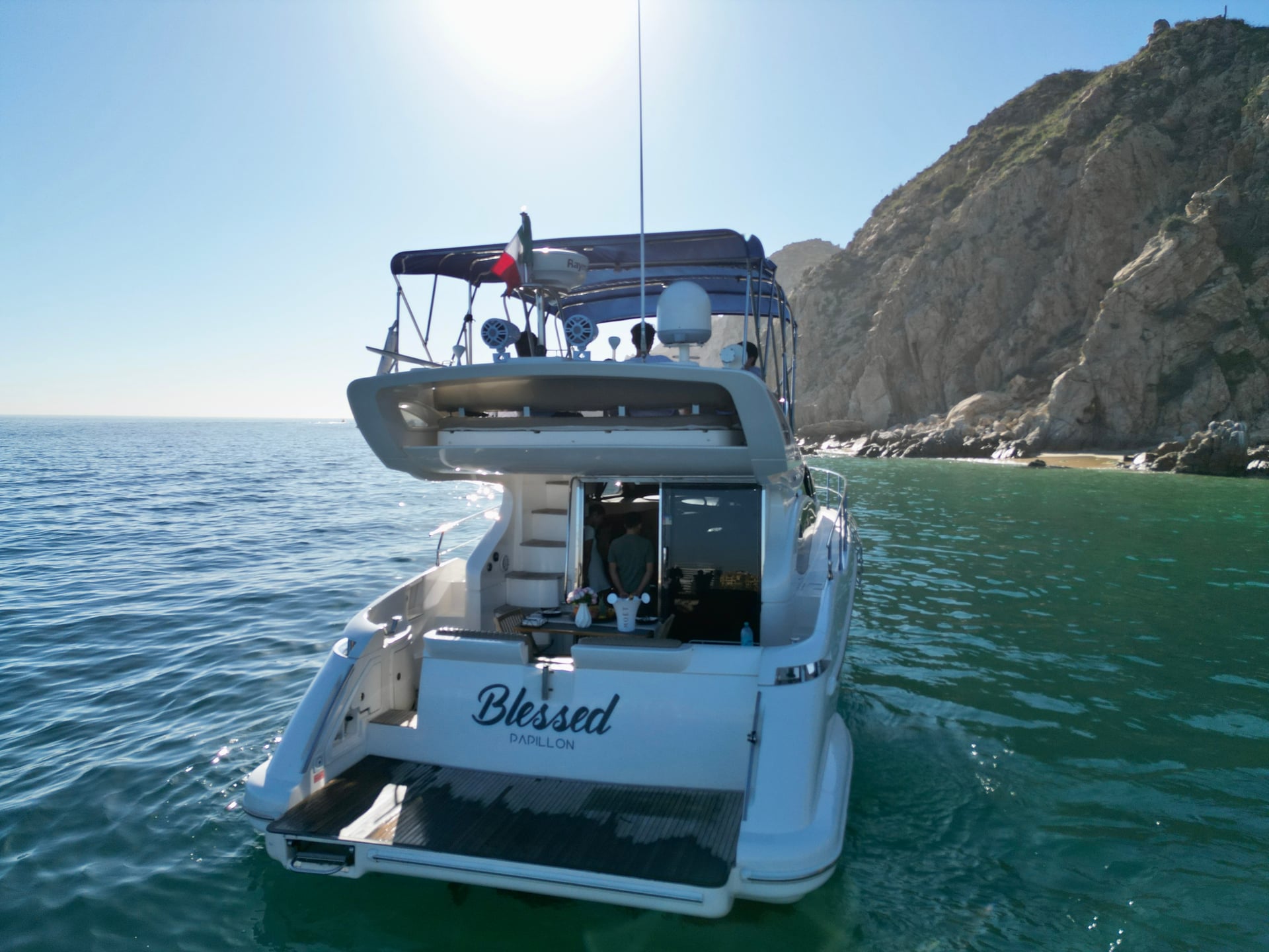 Boat interior on the Azimut 46ft person standing at counter in Cabo San Lucas