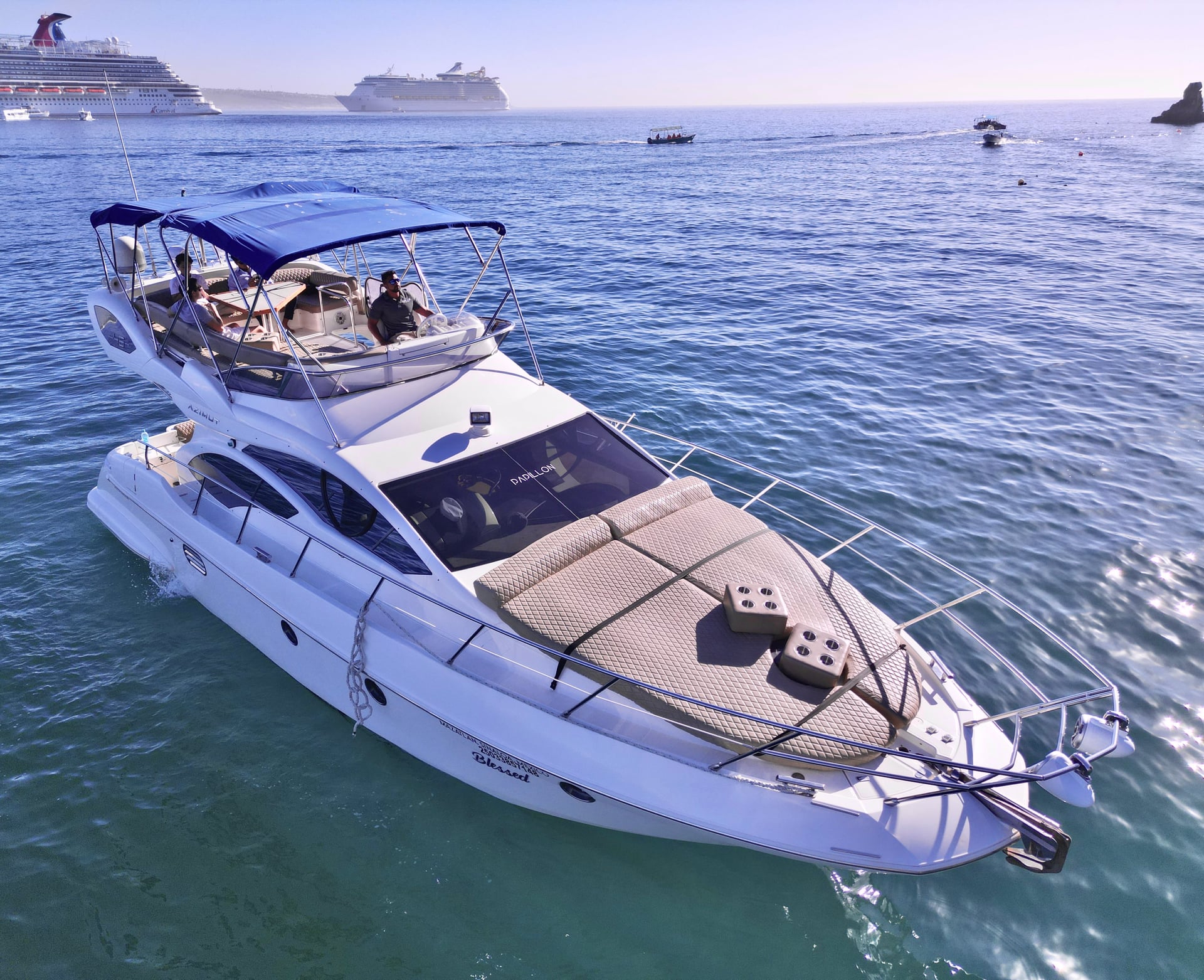 Boat deck on the Azimut 46ft with quilted cushions, blue water in Cabo San Lucas