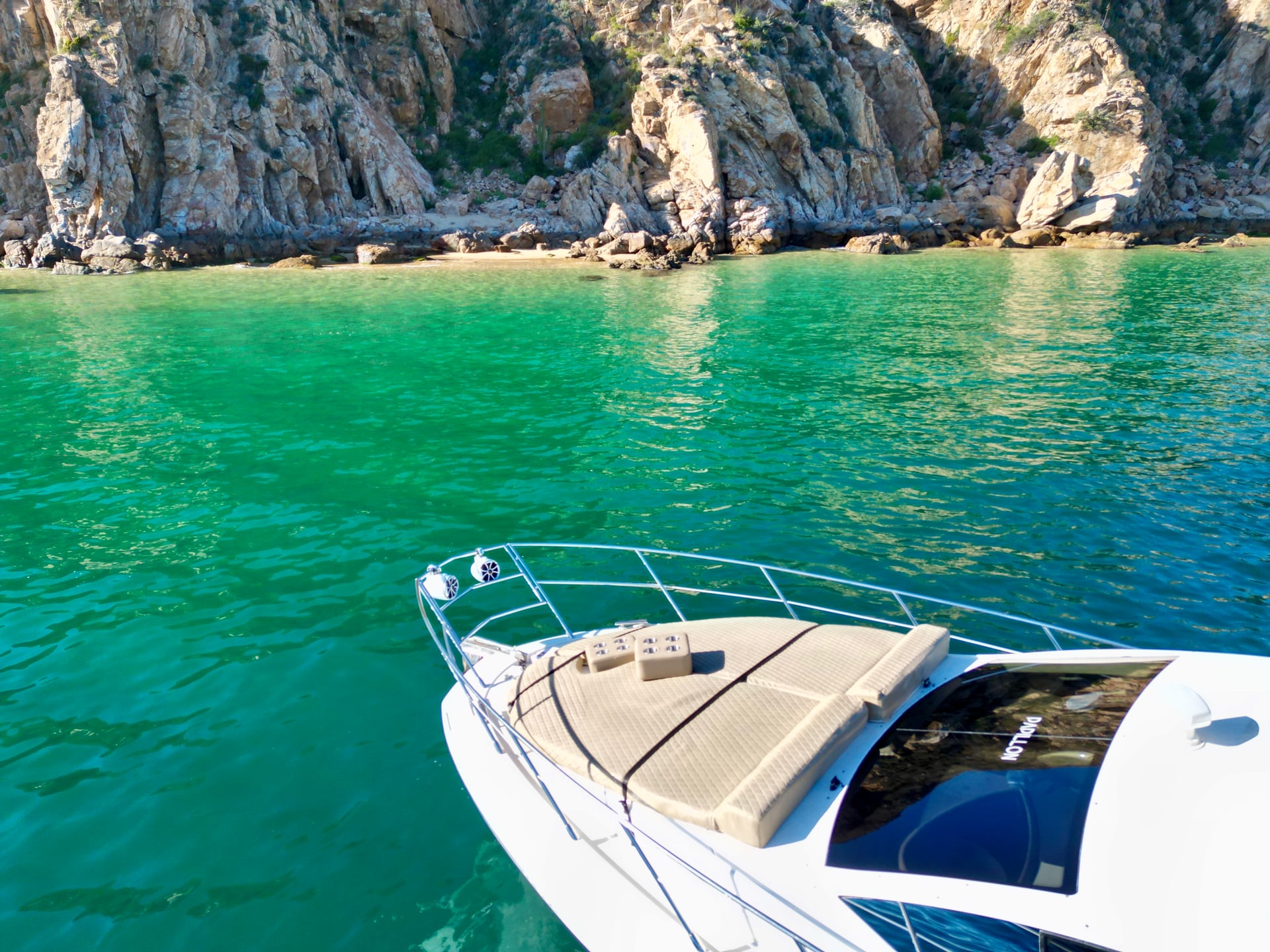 Rocky cove on the Azimut 46ft from boat, clear green water in Cabo San Lucas