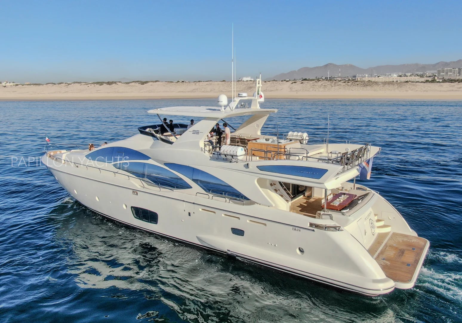 Azimut 95ft, stern view, with beach beyond, in Cabo San Lucas