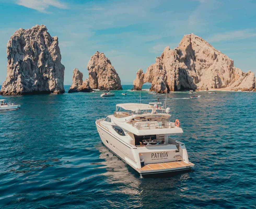 Luxury yacht 2 at Best Bars in Cabo with Ocean Views for Sunset with rock arch beyond