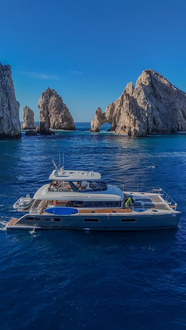 Catamaran yacht at Marlin Fishing Cabo San Lucas: Your 2026 Season Guide to Epic Catches with rock-arch beyond