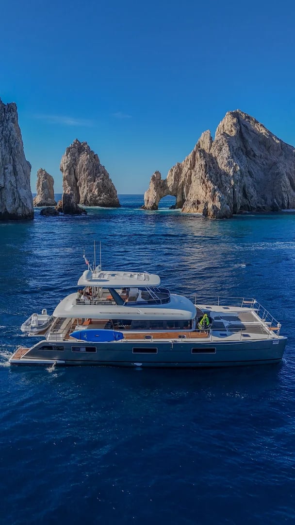Catamaran yacht on the Lagoon 65ft Catamaran with rock-arch beyond in Cabo San Lucas (2)