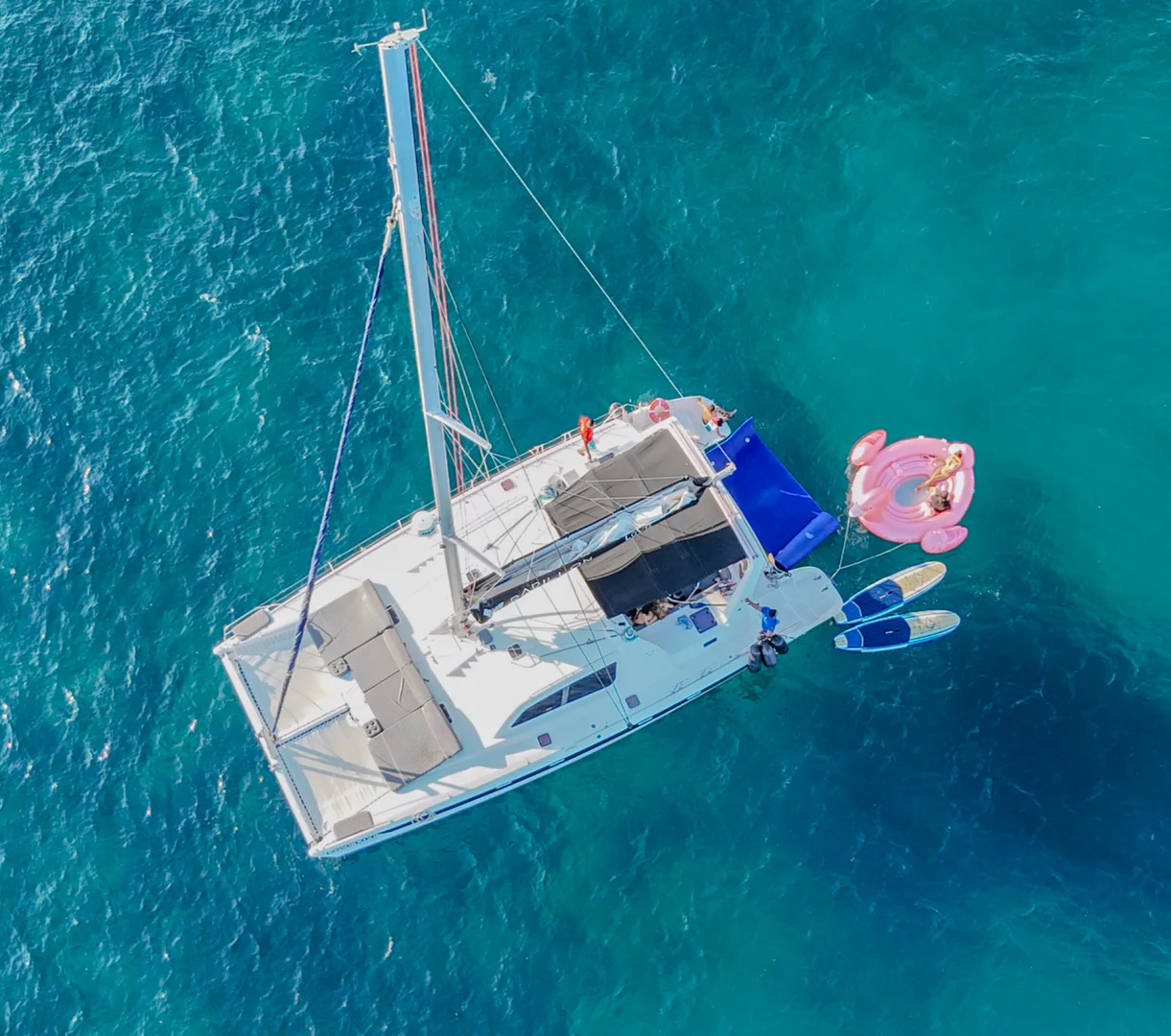 Catamaran aerial on the Luxury Catamaran Leopard 52ft from above, on blue water in Cabo San Lucas