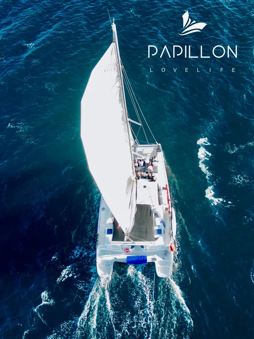 Catamaran sailing aerial on the Luxury Catamaran Leopard 52ft with sail up, on blue water in Cabo San Lucas