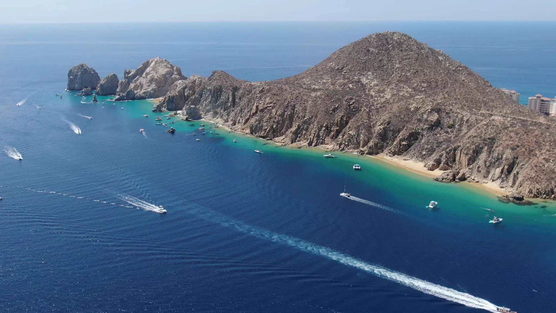 Rocky coastline on the SeaRay Sundancer 45ft aerial view, boats anchored in Cabo San Lucas