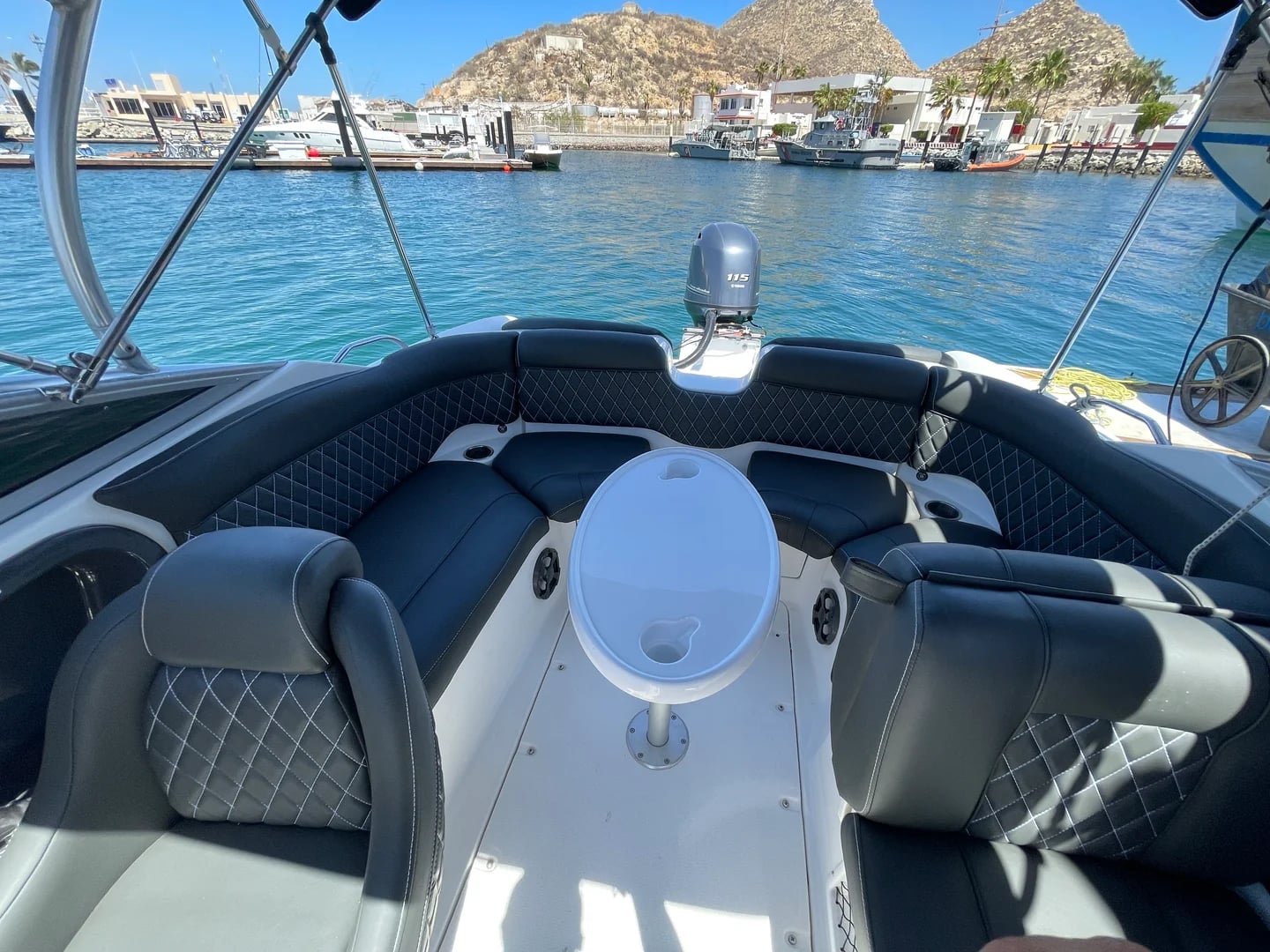 Boat interior on the Yamaha 28ft with seating, outboard motor in Cabo San Lucas