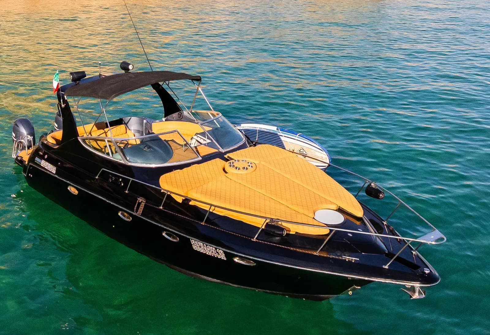 Luxury boat 6 at Bareboat or Captained? Your 2026 Guide to Cabo San Lucas Boat Rentals top down view, with paddleboard